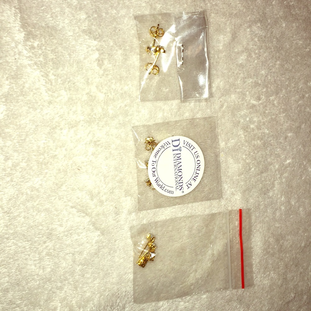 4 pairs of solid gold w/ real diamonds